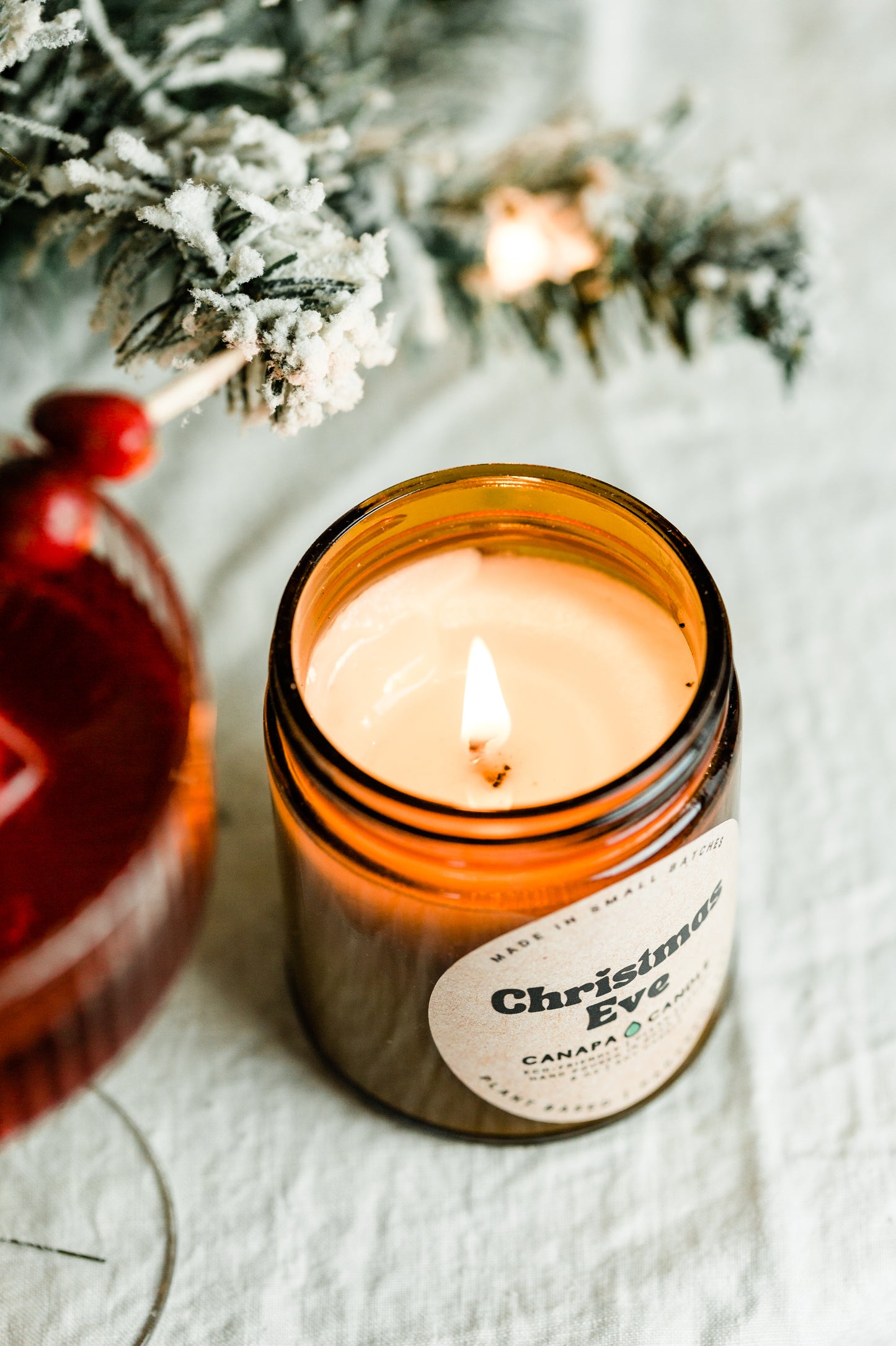 Christmas Eve 9oz Soy Candle made in Canada by Canapa Candle in Louisbourg, Cape Breton Island, Nova Scotia - Vegan, Paraben and Phthalate free - Smells like: Vanilla Cream, Cinnamon, Sugar, Smoke, Sweet Peppermint, Tobacco